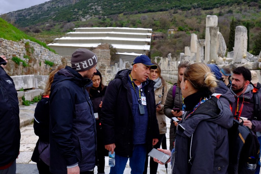 Guests listening to a guide during an operated Ephesus visit.